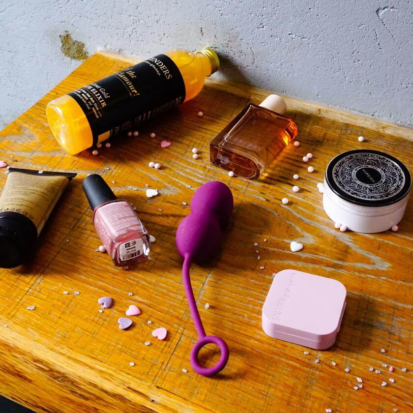 Sex toys and self-care products on a nightstand 