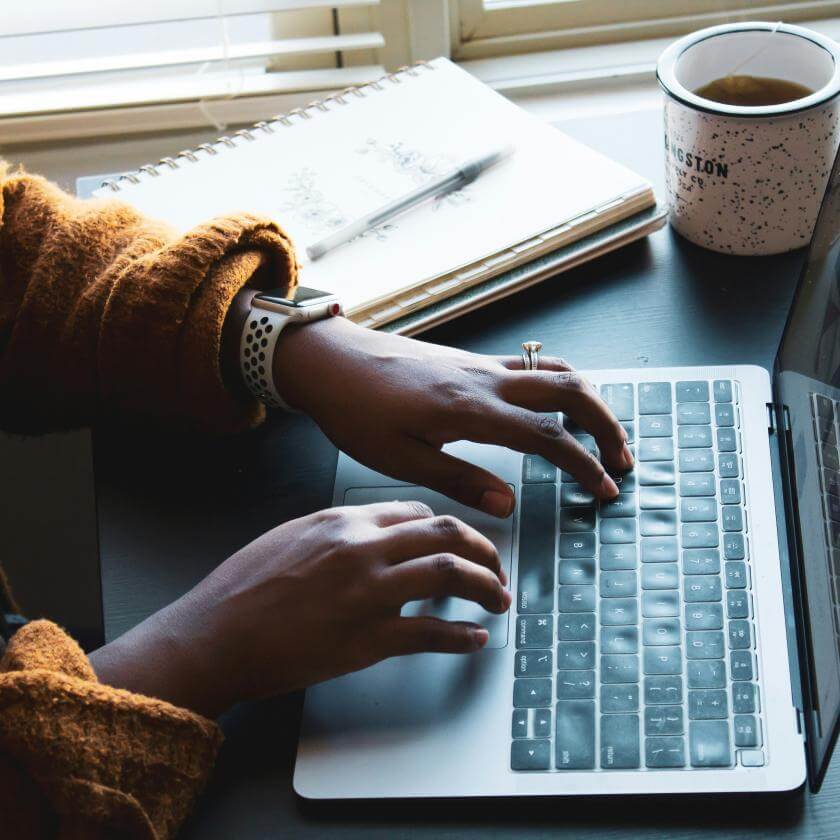 Person typing on a laptop